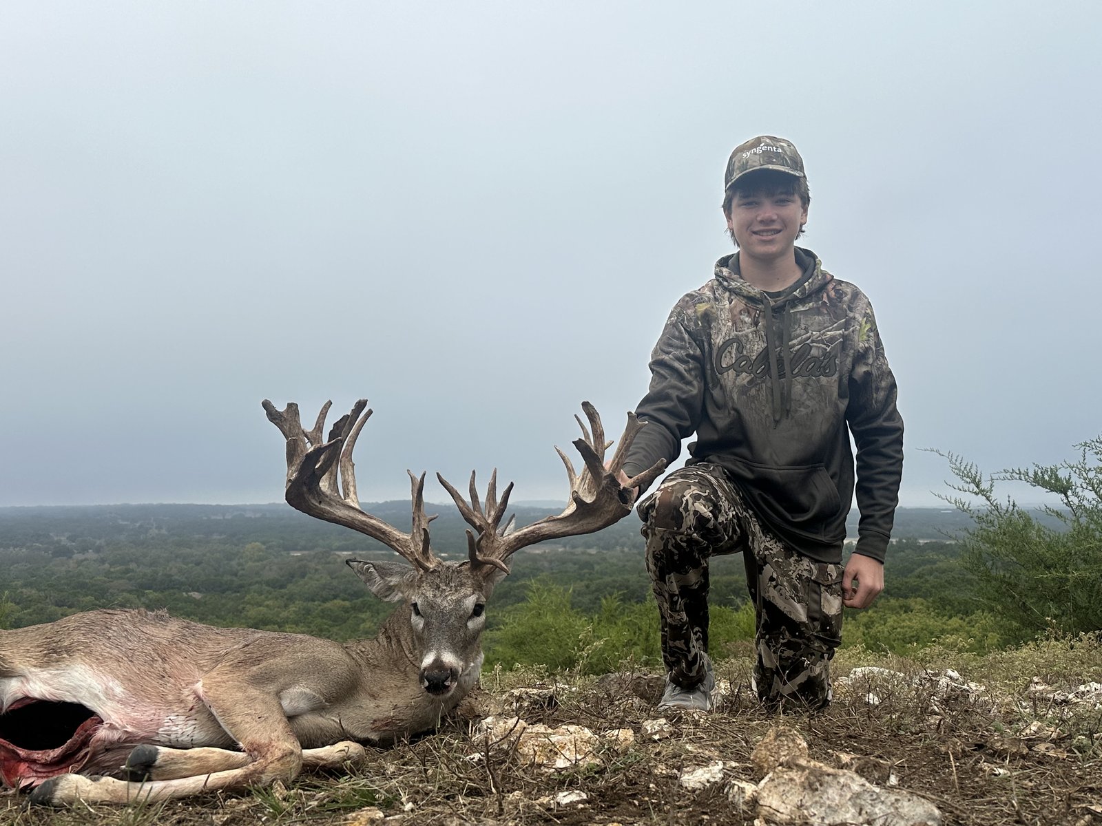 Young hunter with a trophy buck